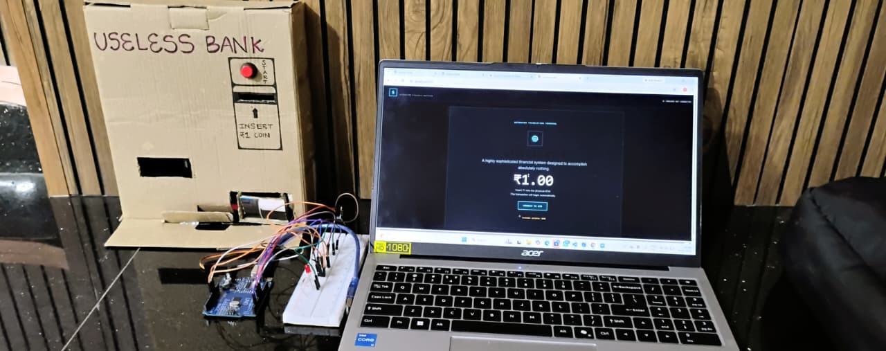 Useless Bank cardboard ATM connected to an Arduino and laptop
